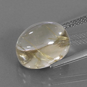 7.12カラットの天然無色＆ゴールドルチルクォーツ（12.3×10 mm・オーバルカット）