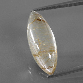 10.87カラットの天然無色＆ゴールドルチルクォーツ（23.3×8.8 mm・マーキス）