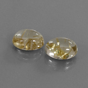 カラットの天然無色＆ゴールドルチルクォーツ（9.8×7.9 mm・オーバルカット）
