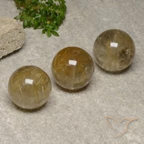 Shop natural 55.78ct 非常に薄いゴールデンブラウン ルチルクォーツ gems, スフェア / ボール, from インド at GemSelect. In stock, global shipping!