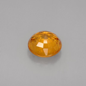 1.55カラットの天然マンダリンオレンジサファイア（6.57 mm・ラウンドカット）