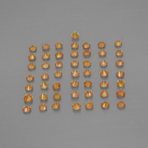 カラットの天然オレンジサファイア（1.74 mm・ラウンドカット）