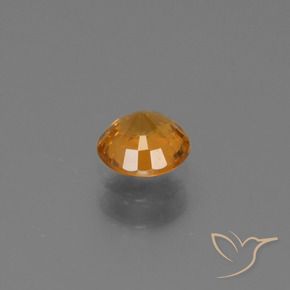 0.67カラットの天然ミディアムダークオレンジサファイア、ラウンド、VS-SI
