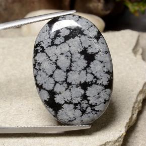 21.09カラットの天然スノーフレークスノーフレークオブシディアン、オーバルカット、オペーク