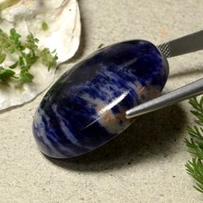 59.51カラットの天然ダークブルーソーダライト、オーバルカット、オペーク