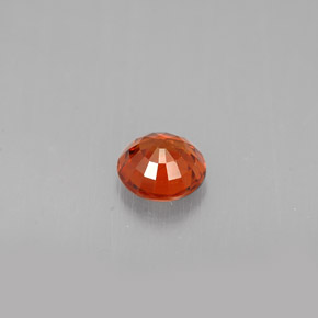 0.64カラットの天然マンダリンオレンジスペサルティンガーネット（4.93 mm・ラウンドカット）
