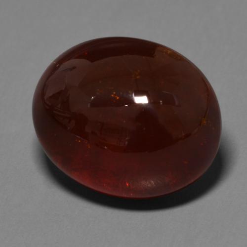 33.34カラットの天然赤みがかった茶スペサルティンガーネット（18.6×15.2 mm・オーバルカット）