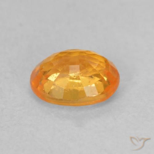 0.55カラットの天然アプリコットオレンジスペサルティン ガーネット、楕円形、VS-SI