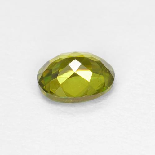 0.46カラットの天然ウォームフォレストグリーンスフェーン（5.1×4.2 mm・オーバルカット）