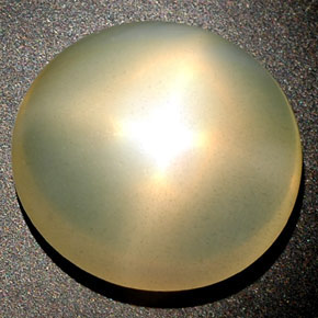 14.98カラットの天然オレンジクリームスタームーンストーン、透明、透明/半透明