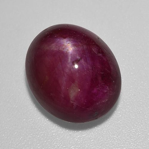 12.01カラットの天然ダークレッドスタールビー（13.8×11.2 mm・オーバルカット）