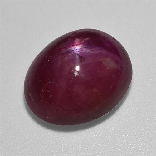 12.01カラットの天然ダークレッドスタールビー（13.8×11.2 mm・オーバルカット）