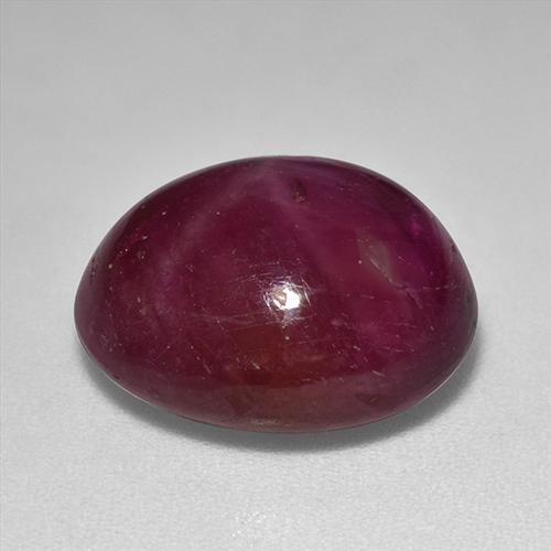 12.01カラットの天然ダークレッドスタールビー（13.8×11.2 mm・オーバルカット）