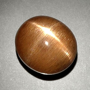 6.93カラットの天然ゴールドブラウンスターサンストーン、オーバルカット、オペーク