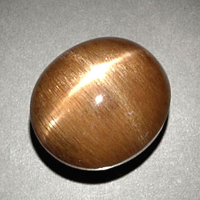 6.93カラットの天然ゴールドブラウンスターサンストーン、オーバルカット、オペーク