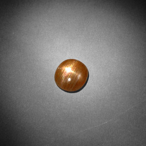 0.85カラットの天然ゴールドブラウンスターサンストーン、オーバルカット、オペーク