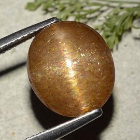 7.25カラットの天然ゴールドブラウンスターサンストーン、オーバルカット、半透明