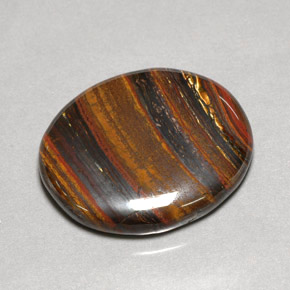 53.09カラットの天然マルチカラーTiger's Eye Matrix（31×26.7 mm・オーバルカット）