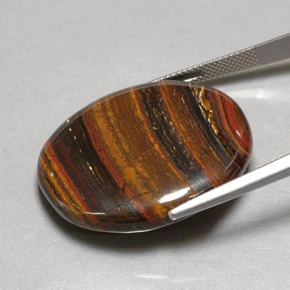53.09カラットの天然マルチカラーTiger's Eye Matrix（31×26.7 mm・オーバルカット）