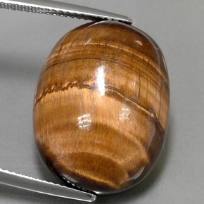 24.80カラットの天然ゴールドブラウンTiger's Eye（21.7×16.8 mm・オーバルカット）