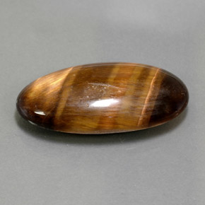 13.84カラットの天然ゴールドブラウンTiger's Eye（25.4×13 mm・オーバルカット）