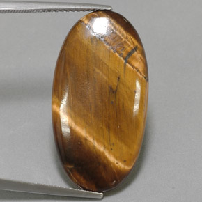 14.24カラットの天然ゴールドブラウンTiger's Eye（27.9×14.7 mm・オーバルカット）