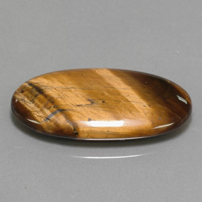 14.24カラットの天然ゴールドブラウンTiger's Eye（27.9×14.7 mm・オーバルカット）