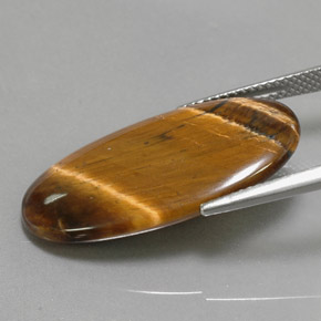 14.24カラットの天然ゴールドブラウンTiger's Eye（27.9×14.7 mm・オーバルカット）