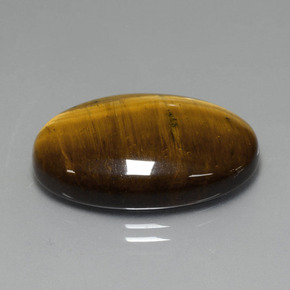 19.40カラットの天然ミディアム薄いブラウンTiger's Eye（24.7×16.6 mm・オーバルカット）