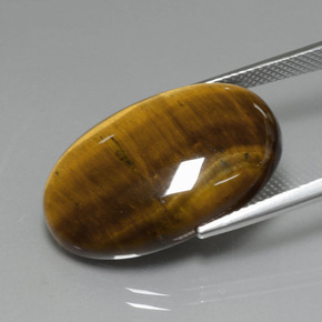 19.40カラットの天然ミディアム薄いブラウンTiger's Eye（24.7×16.6 mm・オーバルカット）