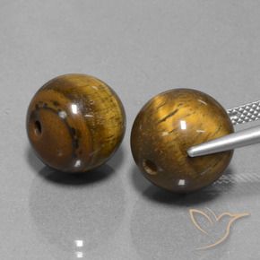 Shop natural 25.67ct ミディアムブラウン タイガーズアイ gems, スフェア / ボール, from タイ at GemSelect. In stock, global shipping!