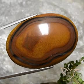 92.65カラットの天然ウォームブラウンTiger's Eye（40.8×29.4 mm・オーバルカット）