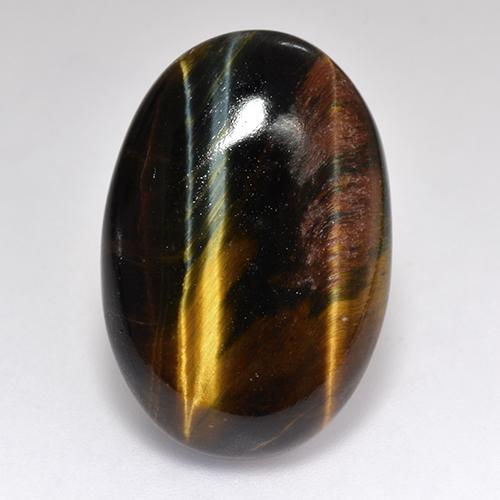 18.46カラットの天然マルチカラーTiger's Eye（23.4×15.8 mm・オーバルカット）