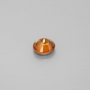 0.98カラットの天然オレンジジルコン（5.58 mm・ラウンドカット）