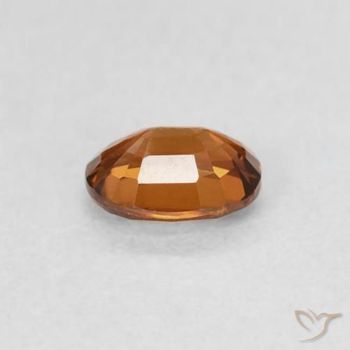 0.60カラットの天然Medium Dark-Orangeジルコン、楕円形、VS