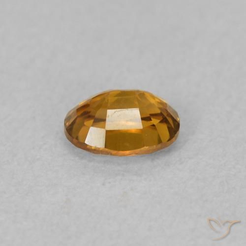 0.63カラットの天然茶色がかったオレンジジルコン、楕円形、VVS-VS